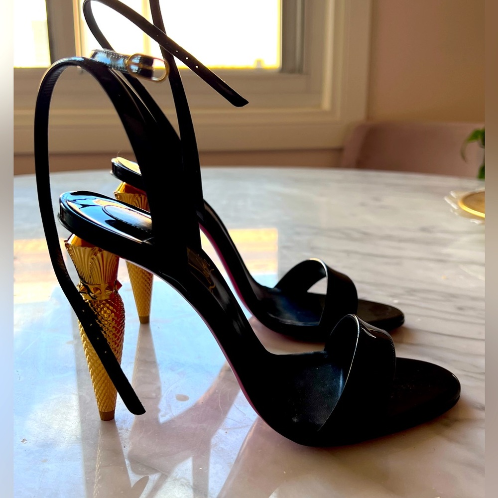 Christian Louboutin LipQueen 100 black patent leather strappy heel.
